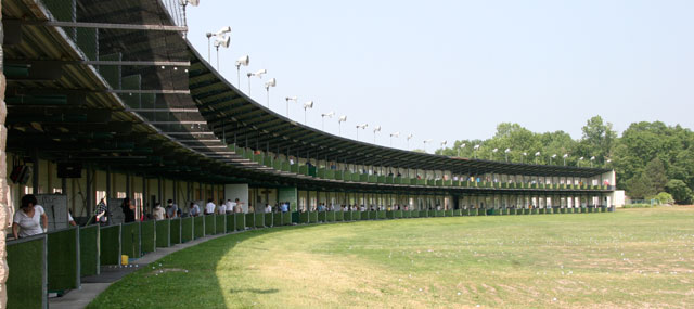 Closter driving range from the side with trees