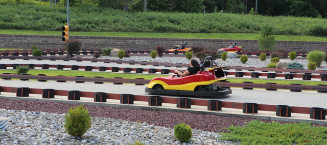 Racers speeding down the go-kart track at Closter Golf Center in Tappan, NY