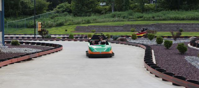 Parent and child enjoying go-karts at Closter Golf Center